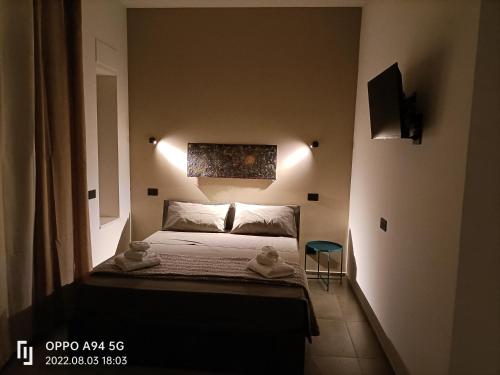 Letto o letti in una camera di La Sartoria dei Sogni
