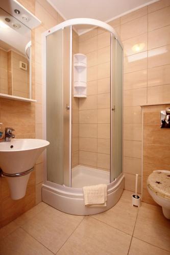 a bathroom with a shower and a sink at Apartments with parking space Orebic, Peljesac - 10423 in Orebić