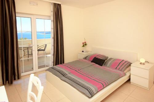Postel nebo postele na pokoji v ubytování Apartments with a parking space Orebic, Peljesac - 10423