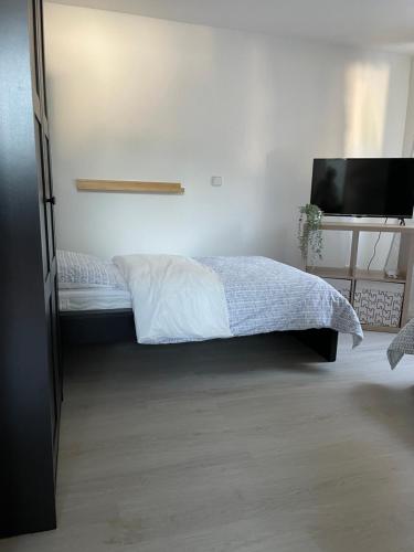 Ένα ή περισσότερα κρεβάτια σε δωμάτιο στο SANO Apartments - Bei Uwe