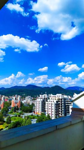 a view of a city with buildings and a blue sky at Hotel Mara in Baia Mare