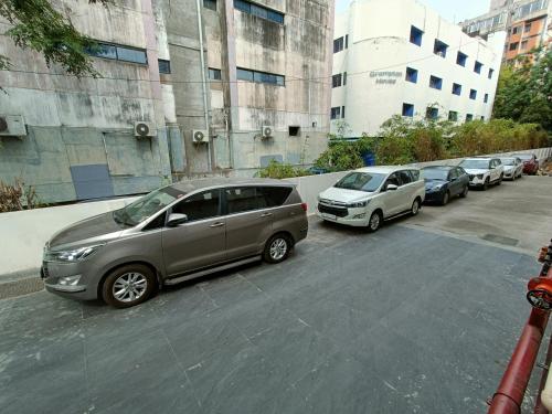 a row of cars parked in a parking lot at The Kings Park Grand-Near US Consulate in Chennai