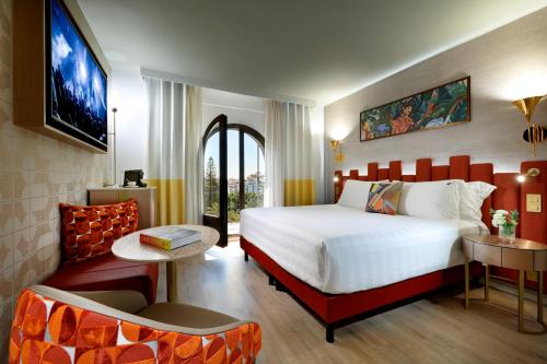 a hotel room with a bed and a chair at Hard Rock Hotel Marbella - Puerto Banús in Marbella