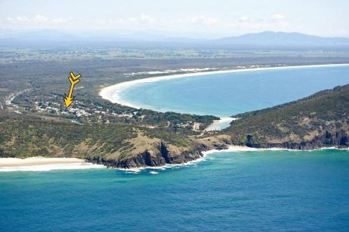 an aerial view of a beach and the ocean at Hat Head Holiday House - Bring your own linen in Hat Head
