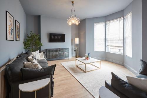 a living room with a couch and a table at Host & Stay - Parkside Villa in Harrogate