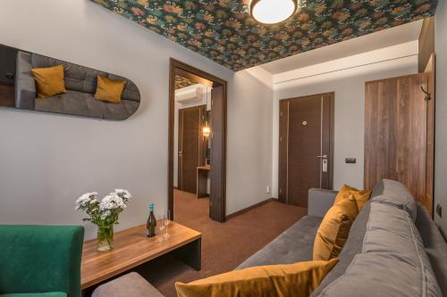 a living room with a couch and a table at Brovar 16 in Pszczyna