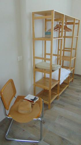 a room with two bunk beds and a table and a chair at Il Giardino di Marzo Guest House in Monti di Licciana Nardi