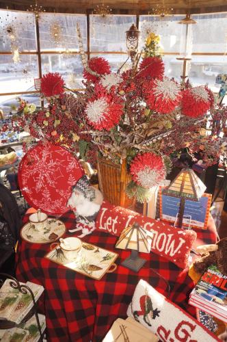 a table with christmas presents and a christmas tree at Greenbrier Inn Killington in Killington