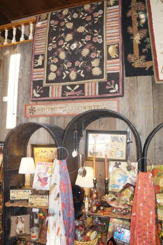 a room with a table and a rug on the wall at Greenbrier Inn Killington in Killington