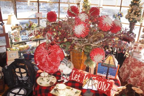 a christmas tree in a store with presents under it at Greenbrier Inn Killington in Killington