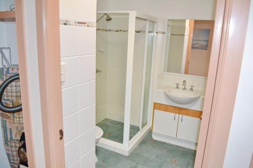 a bathroom with a shower and a sink at Paragon Apartment 8 in South West Rocks