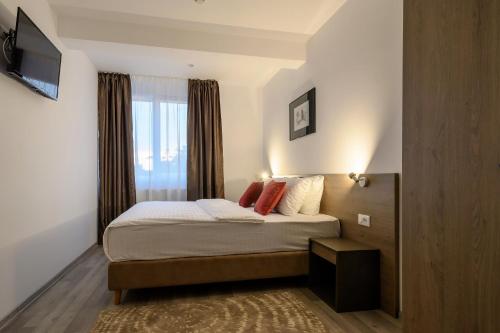 Un pat sau paturi într-o cameră la VMD Residence