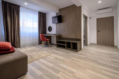 TV a/nebo společenská místnost v ubytování VMD Residence