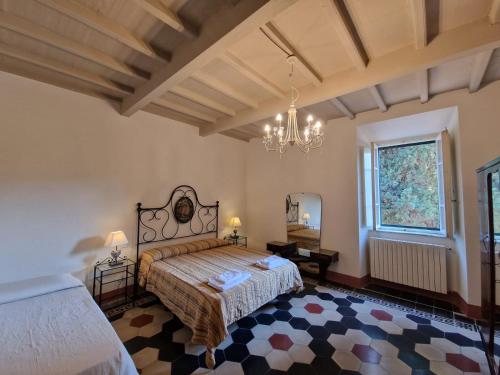 Posteľ alebo postele v izbe v ubytovaní Dimora storica nel cuore della Toscana