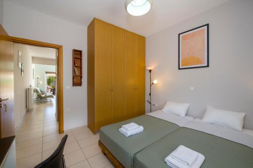 Postel nebo postele na pokoji v ubytování Peris House Souda