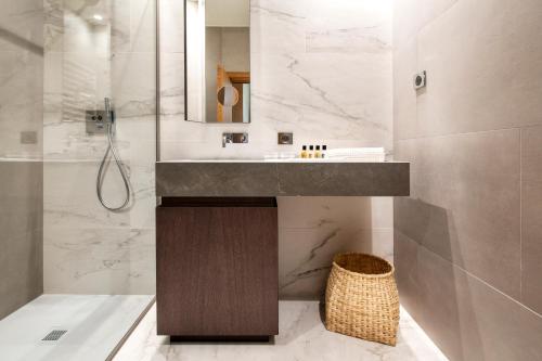 a bathroom with a sink and a shower at Chateau de Wallerand in Vireux-Wallerand