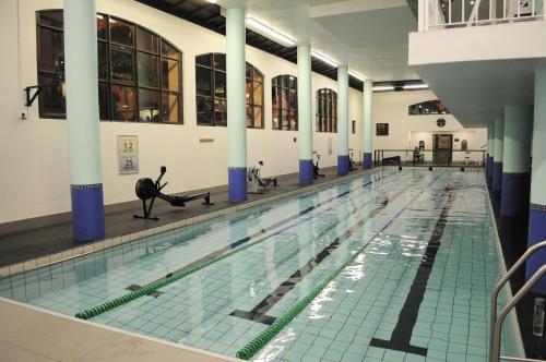 a swimming pool with a person exercising in it at Luxury 2 bedroom apartment in Cape Town in Cape Town