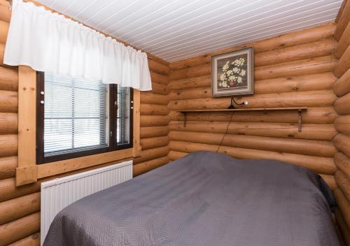 Postel nebo postele na pokoji v ubytování Onnela 2 - Chalet