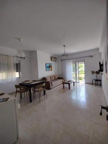 a living room with a couch and a table at Amazing View Apartments at Kroi i Gjine, Piqeras in Piqeras