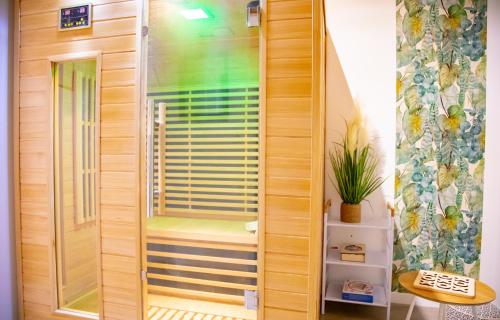 a shower with a glass door in a bathroom at Monti-love in Montivilliers