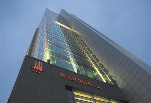 a tall building with an american airlines sign on it at Andersia Hotel & Spa Poznan, a member of Radisson Individuals in Poznań