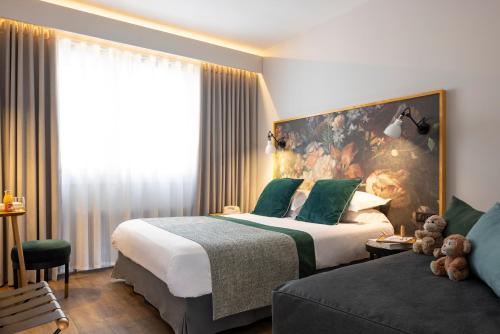 Un ou plusieurs lits dans un hébergement de l'établissement Hôtel Edmond W Lyon Part-Dieu