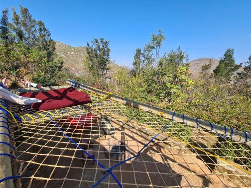 a person laying on top of a net at Hidden Valley Backpackers in Iringa