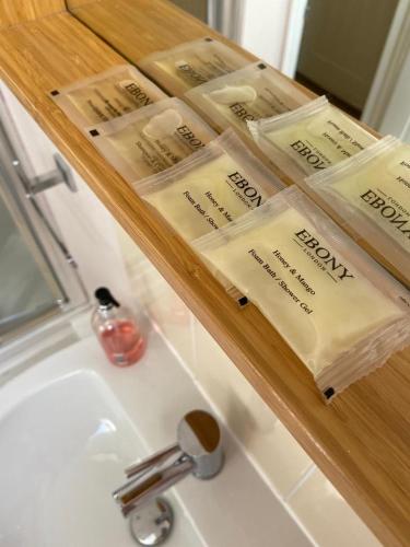 a bathroom sink with a rack of toiletries on it at The Ashton Mews in Bristol