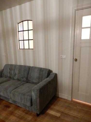 Χώρος καθιστικού στο Recreatieappartement BoerdeRijlst - De Winkel