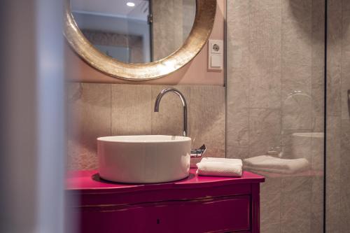 a bathroom with a sink and a mirror at Loom in Bolzano