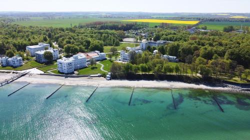 a large body of water with a lighthouse at Grand Hotel Heiligendamm - The Leading Hotels of the World in Heiligendamm