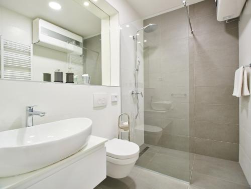 a bathroom with a sink and a toilet and a shower at Bed of Roses APT 1, Luxury, Designer decorated in Zagreb