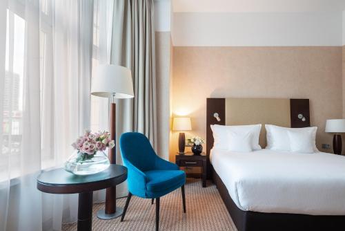 Postel nebo postele na pokoji v ubytování Hotel Polonia Palace