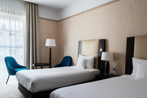 Postel nebo postele na pokoji v ubytování Hotel Polonia Palace