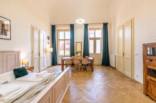 a living room with a couch and a table at Celetná - Old Town Residence in Prague