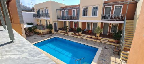 an aerial view of a house with a swimming pool at Vecchio Hotel in Rethymno Town