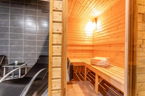 a sauna at a restaurant with wooden walls at Wellness Villa Klínovec Views in Loučná pod Klínovcem