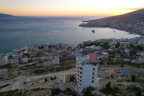 an aerial view of a city and the ocean at Sky Way SKK Luxury Apartments in Sarandë