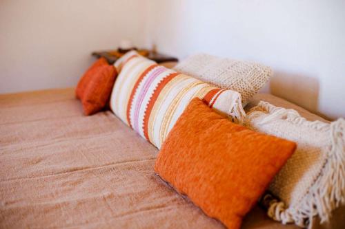 a group of pillows sitting on a couch at Estancia Rio de Arena in Colalao del Valle