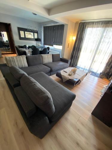 a living room with a couch and a table at Handra Villa in Asfendioú