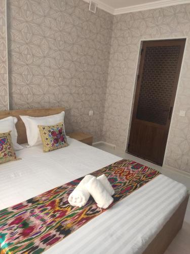 Katil atau katil-katil dalam bilik di Samarkand City Center Hotel