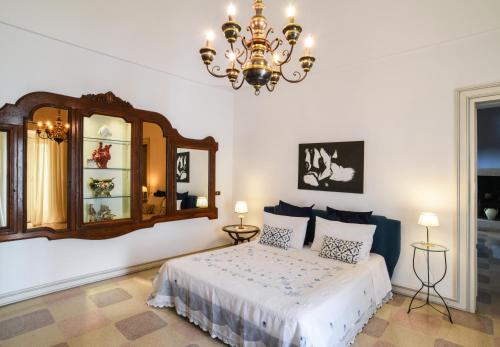 Ένα ή περισσότερα κρεβάτια σε δωμάτιο στο Palazzo Rodio