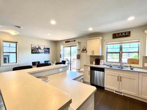 a kitchen with a sink and a counter top at Perfect base Invermere 3bd townhouse mt views with garage in Invermere