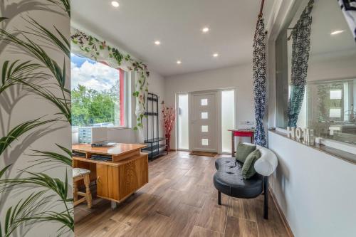 a living room with a desk and a chair at Mountain View Lodge Bulgaria in Ranentsi