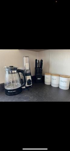 a kitchen counter with a blender and other appliances at Yogi's Space in Birchington