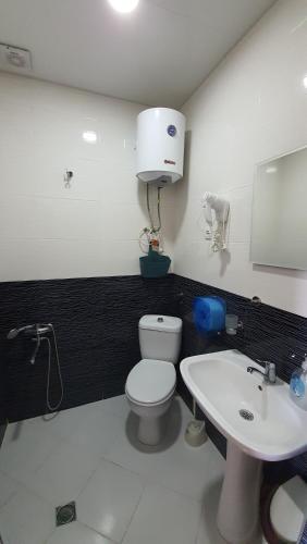 A bathroom at Calypso Kvariati Hotel