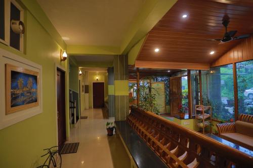 a room with a church with benches and a ceiling at Green Valley Vista in Munnar
