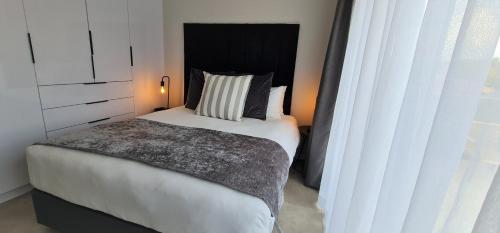Katil atau katil-katil dalam bilik di MINT Apartments Greenside