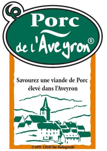 a sign with a picture of a village and a church at Village 17 gites, Piscine, Restaurant , 2 gites avec SPA, 3km de Conques in Conques