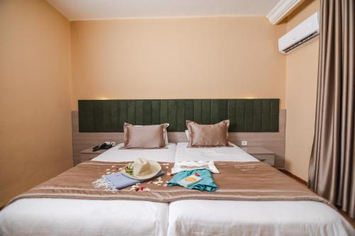 Postel nebo postele na pokoji v ubytování Hotel Alrawabi